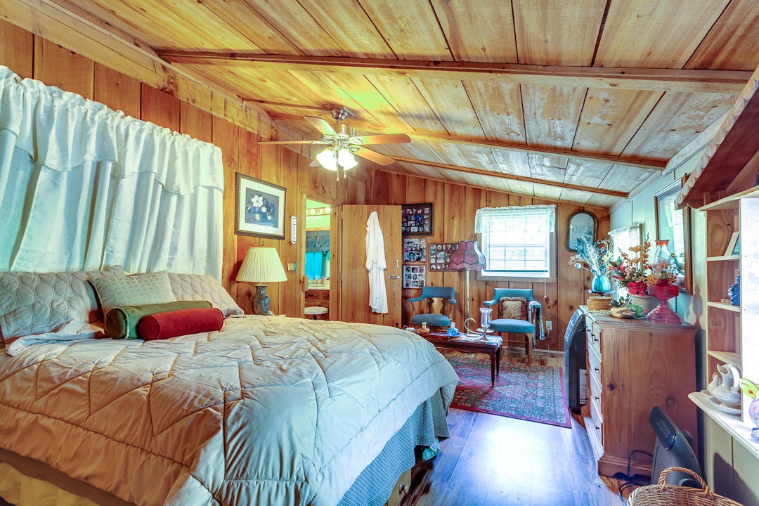 4142 Wilhite Road Sevierville, TN 37876 - Photo 24 of 33 a bedroom with a bed and a large window