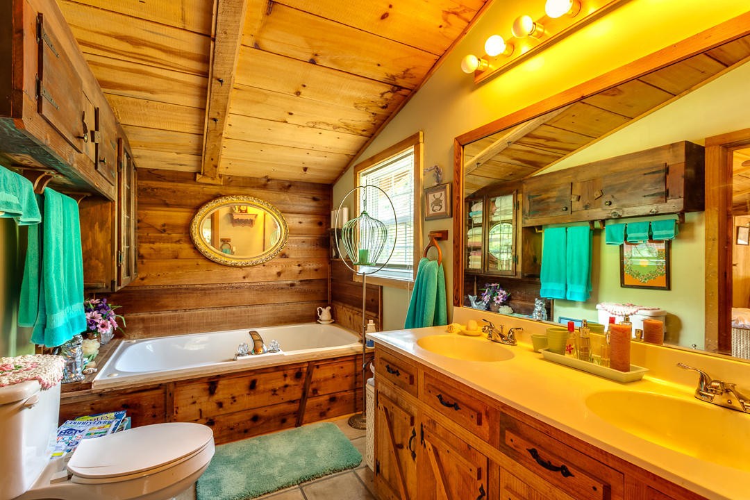 4142 Wilhite Road Sevierville, TN 37876 - Photo 25 of 33 a bathroom with a sink mirror vanity and toilet