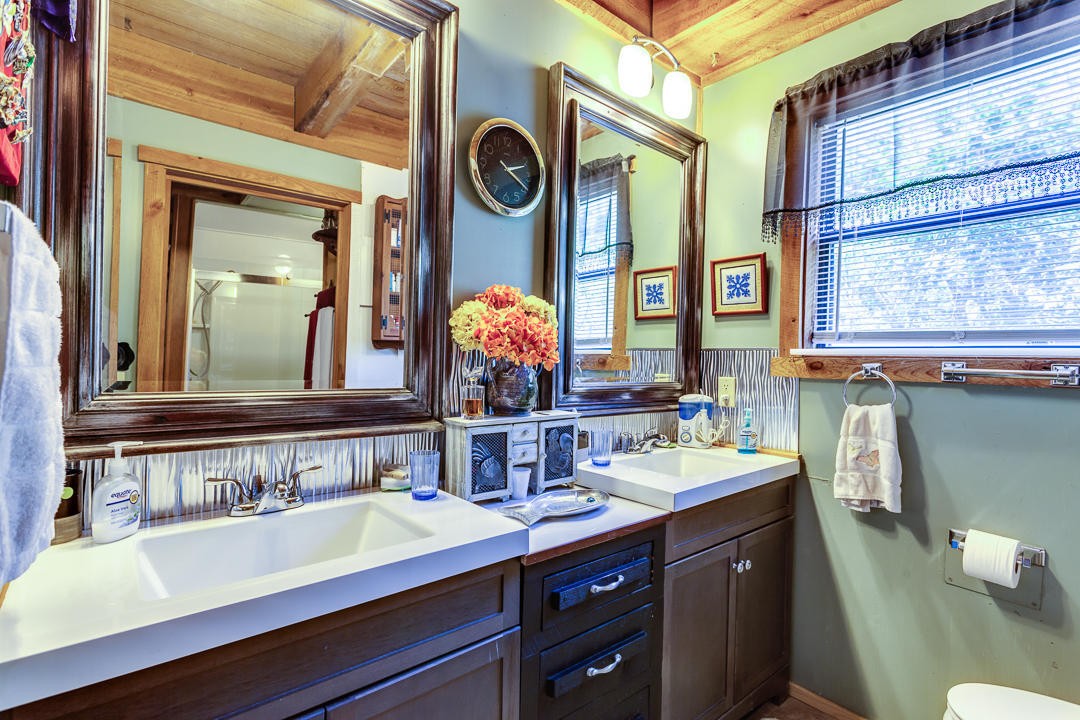 4142 Wilhite Road Sevierville, TN 37876 - Photo 8 of 33 a bathroom with a sink and a mirror