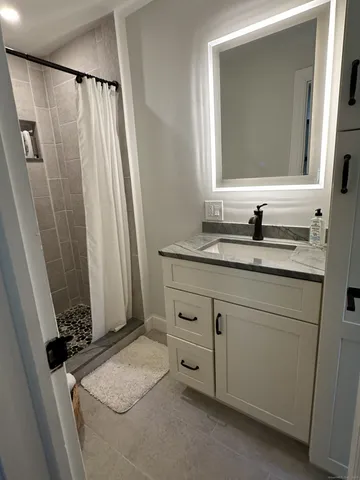 a bathroom with a sink and a mirror