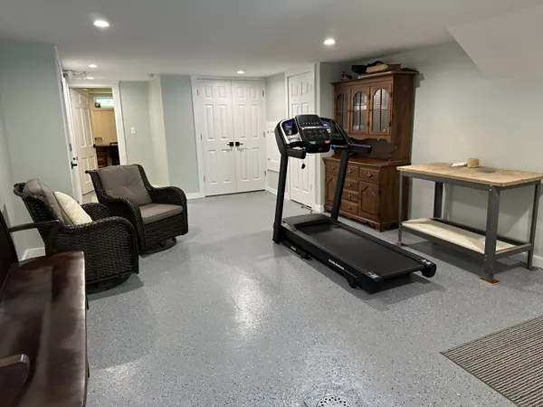 a room with gym equipment and a counter top space