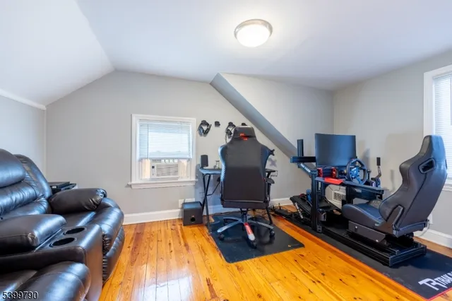 a view of a livingroom with workspace and a couch