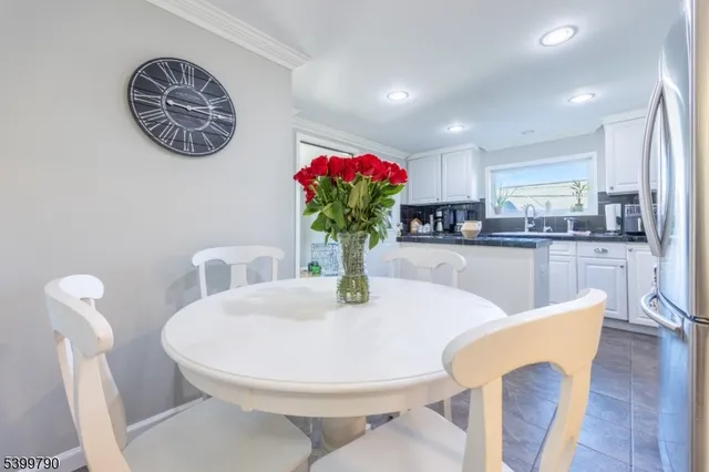 a view of a dining room with furniture wooden floor and a chandelier