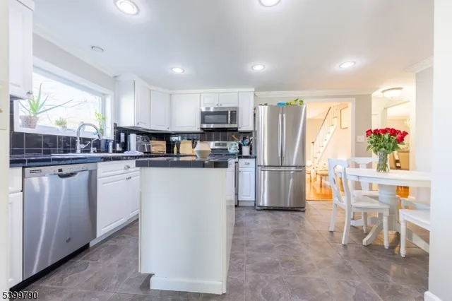 a kitchen with counter space cabinets and appliances