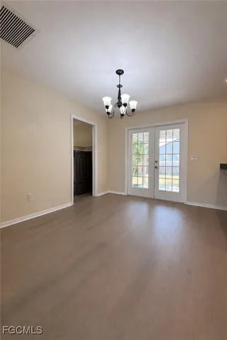 an empty room with a empty space and a ceiling fan