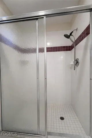 a view of an empty room and a window