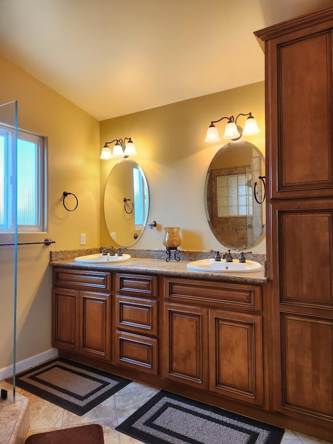 45 Chestnut Street Salinas, CA 93901 - Photo 14 of 23 a bathroom with a sink and a mirror