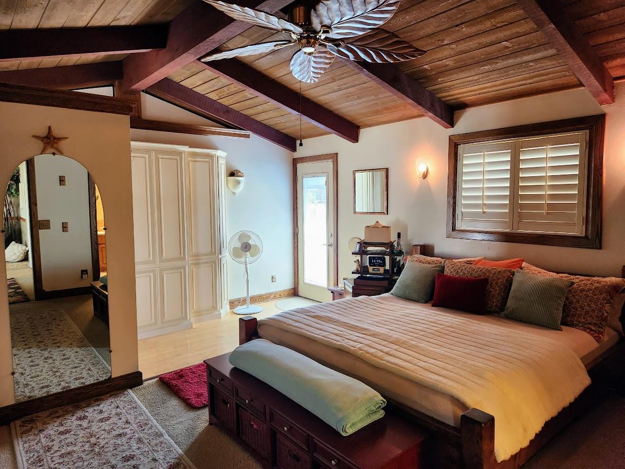 45 Chestnut Street Salinas, CA 93901 - Photo 18 of 23 a bedroom with bed and a chandelier