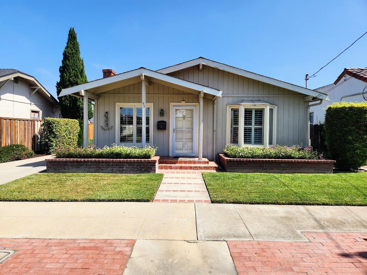 45 Chestnut Street Salinas, CA 93901 - Photo 2 of 23 a front view of a house with a yard and potted plants
