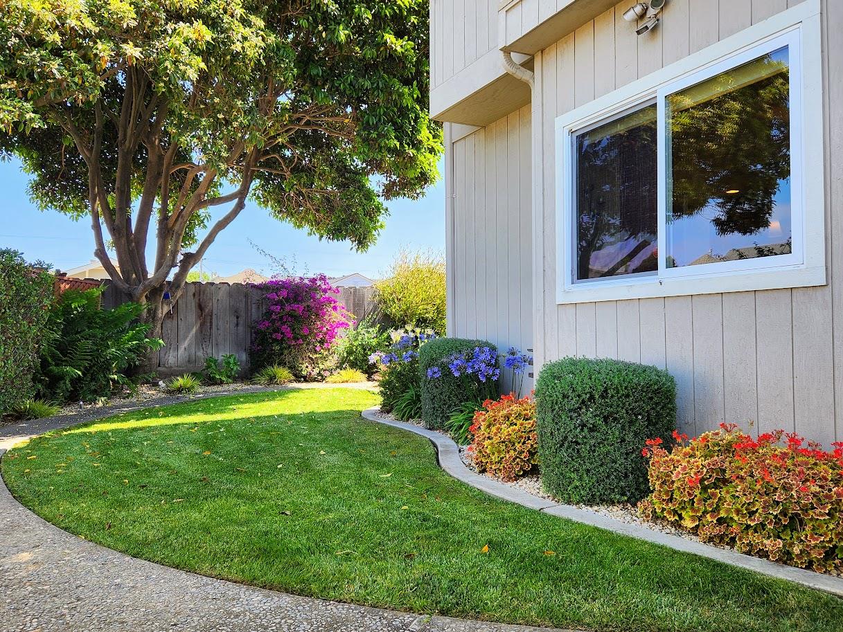 45 Chestnut Street Salinas, CA 93901 - Photo 22 of 23 a front view of a house with a yard and garage