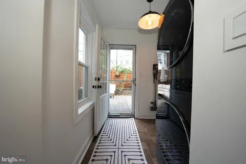 a patio with table and chairs