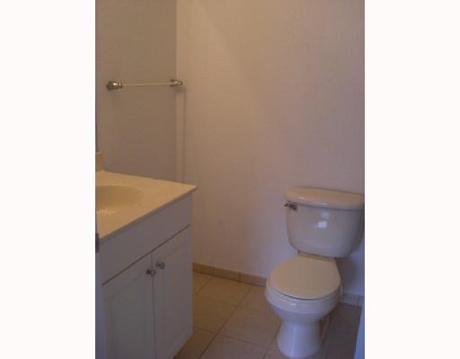 1920 Hibiscus Lane, Unit 163 Riviera Beach, FL 33404 - Photo 10 of 16 a bathroom with a toilet and a sink