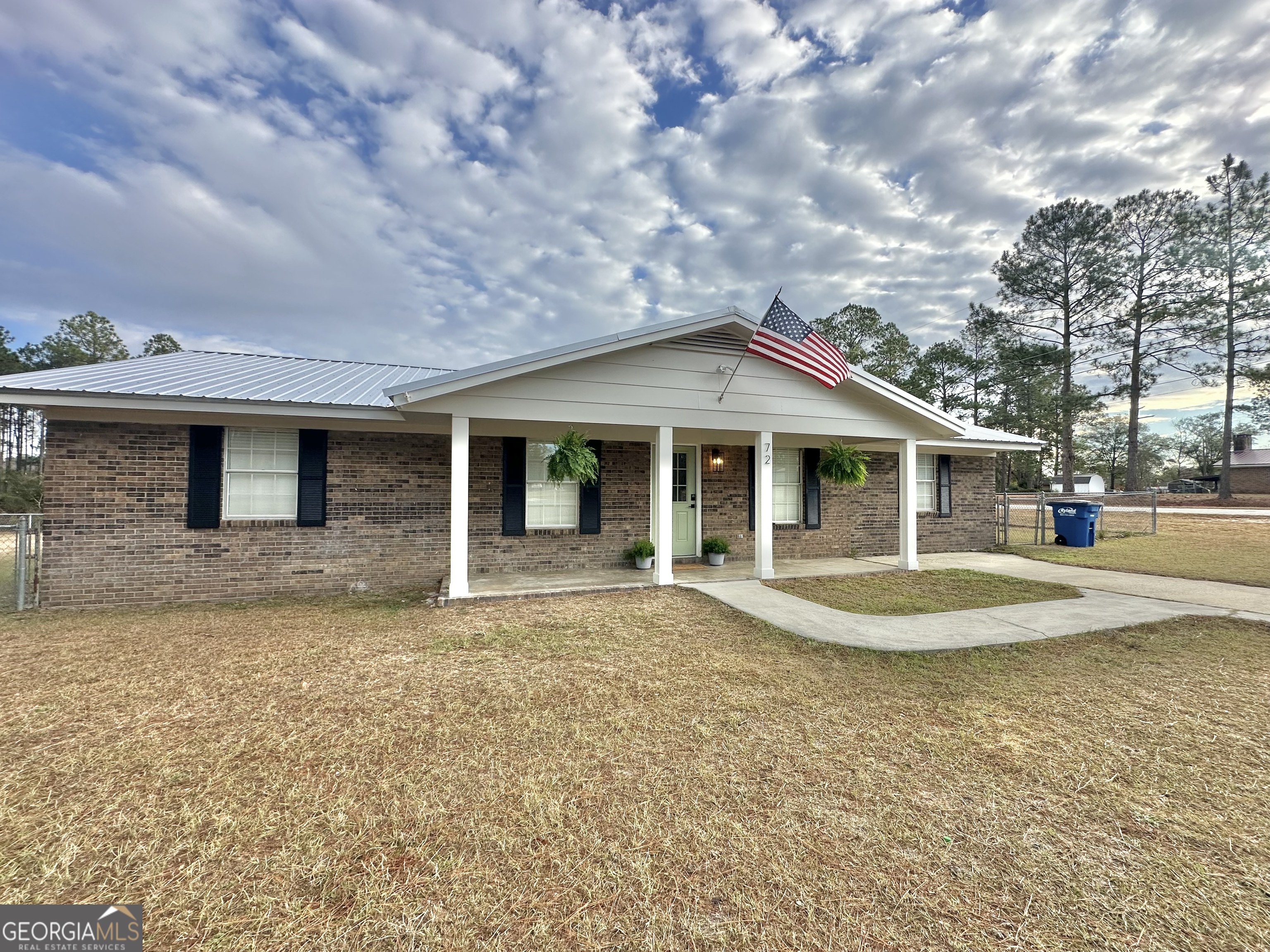 72 10th Street McRae-Helena, GA 31037 - Photo 1 of 26 a front view of a house with a garden