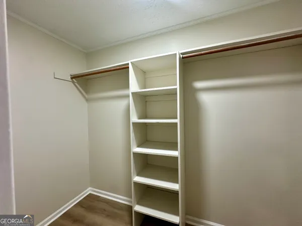 a view of an empty walk in closet