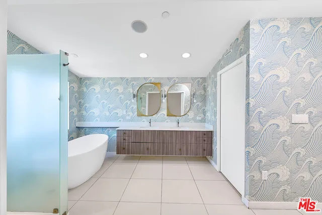 a bathroom with a bathtub and shower