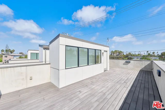 a view of balcony with wooden floor