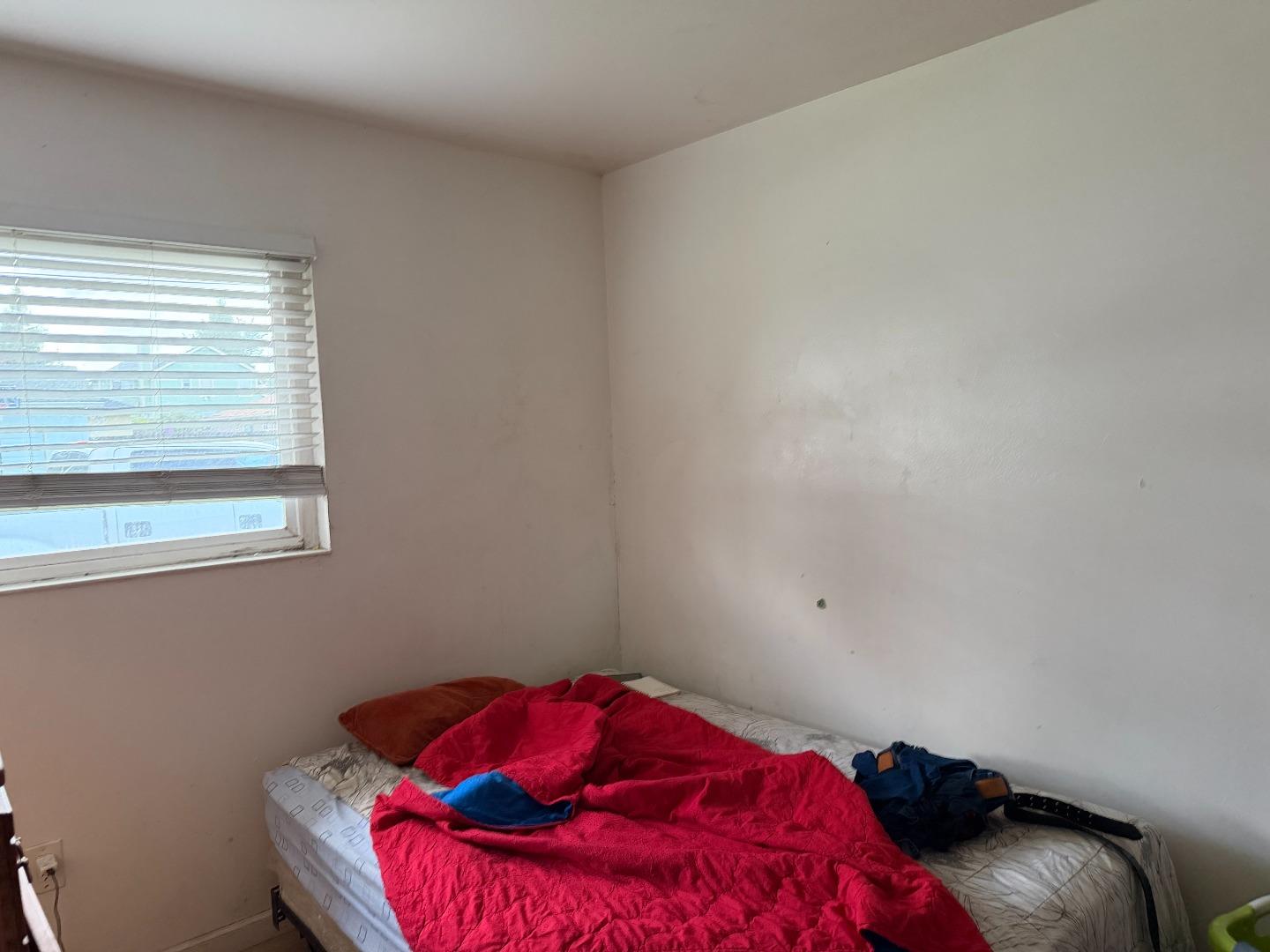 1704 Dutton Avenue Santa Rosa, CA 95407 - Photo 10 of 10 a bedroom with a bed and a window