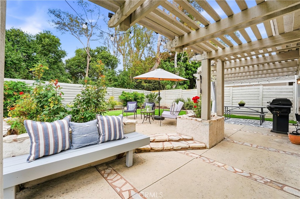 11 Shadowleaf Irvine, CA 92614 - Photo 14 of 23 Raised planter beds with mature flowers, seated benches and a pergola create an outdoor area you will want to linger in.