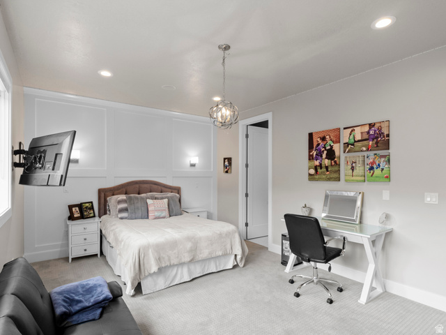 614 East High Lane Alpine, UT 84004 - Photo 53 of 75 Carpeted bedroom featuring a decorative wall, a desk, and suspended lighting