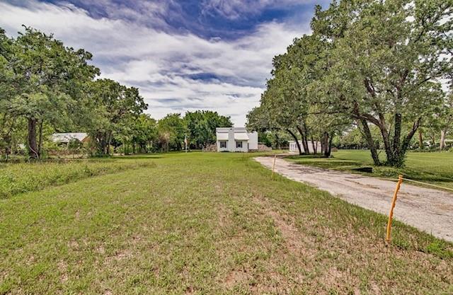 This beautifully remodeled country home is situated amongst mature trees at the end of a long driveway.