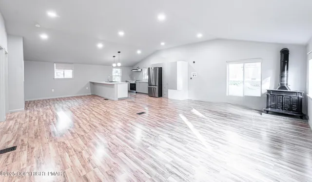 a view of a kitchen with a sink and a window