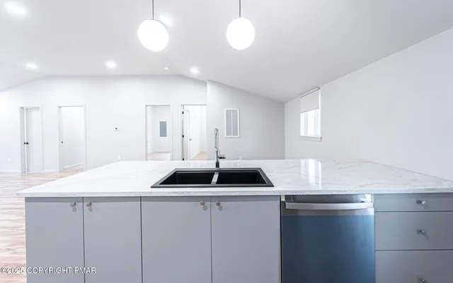 a kitchen with a sink and cabinets