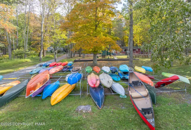 an outdoor space with furniture and garden