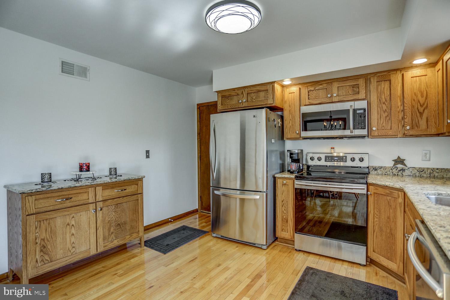 31 Trail Road South Elizabethtown, PA 17022 - Photo 12 of 40 a kitchen with stainless steel appliances granite countertop a refrigerator stove and sink