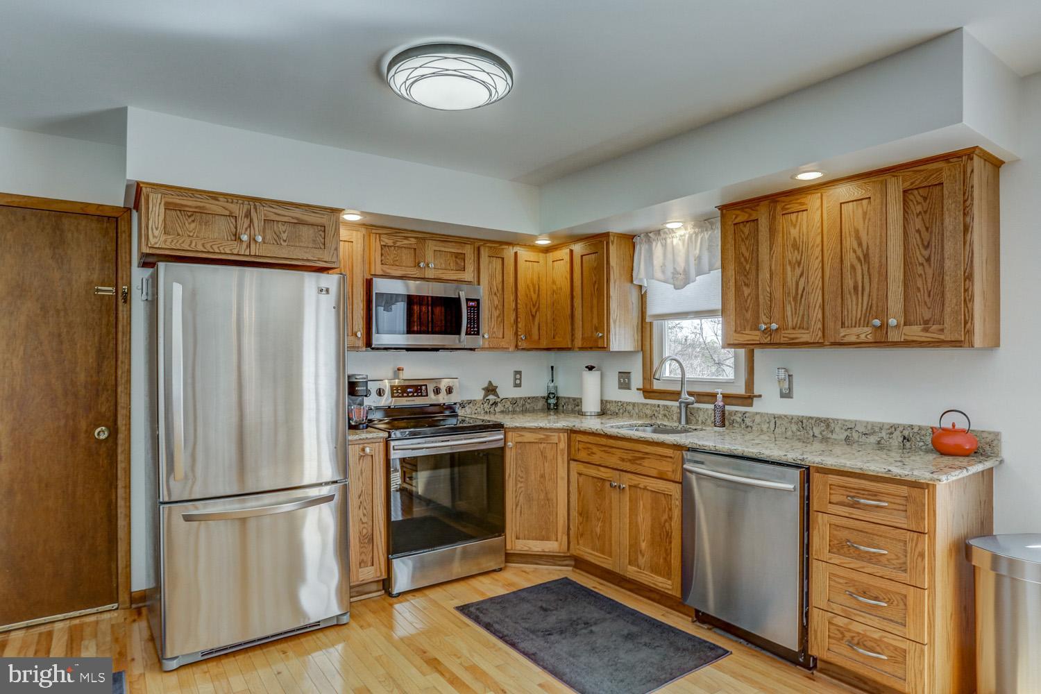 31 Trail Road South Elizabethtown, PA 17022 - Photo 13 of 40 a kitchen with stainless steel appliances granite countertop a refrigerator sink and stove