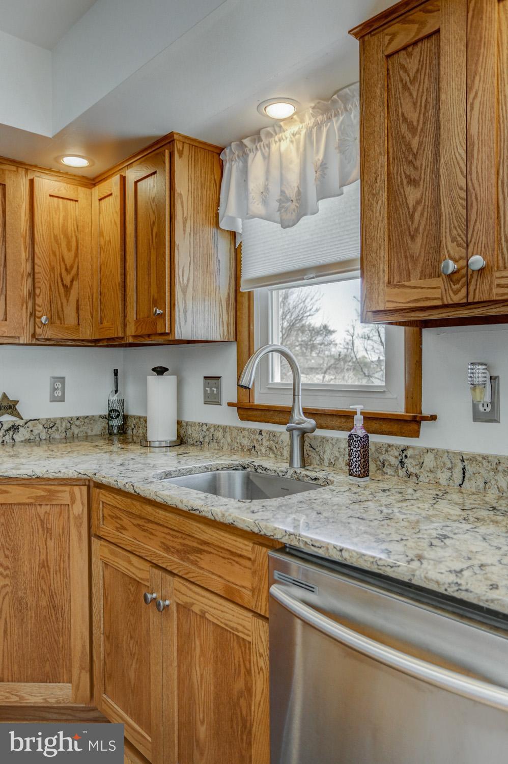 31 Trail Road South Elizabethtown, PA 17022 - Photo 15 of 40 a kitchen with granite countertop a sink a stove and cabinets