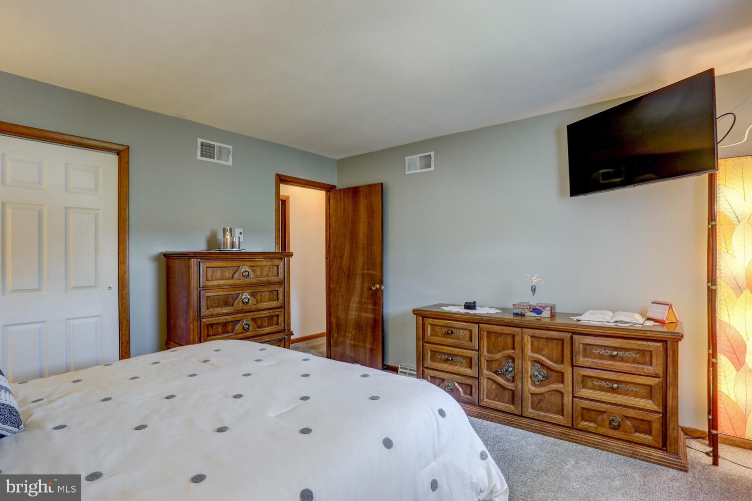 31 Trail Road South Elizabethtown, PA 17022 - Photo 22 of 40 a bedroom with a bed and flat screen tv