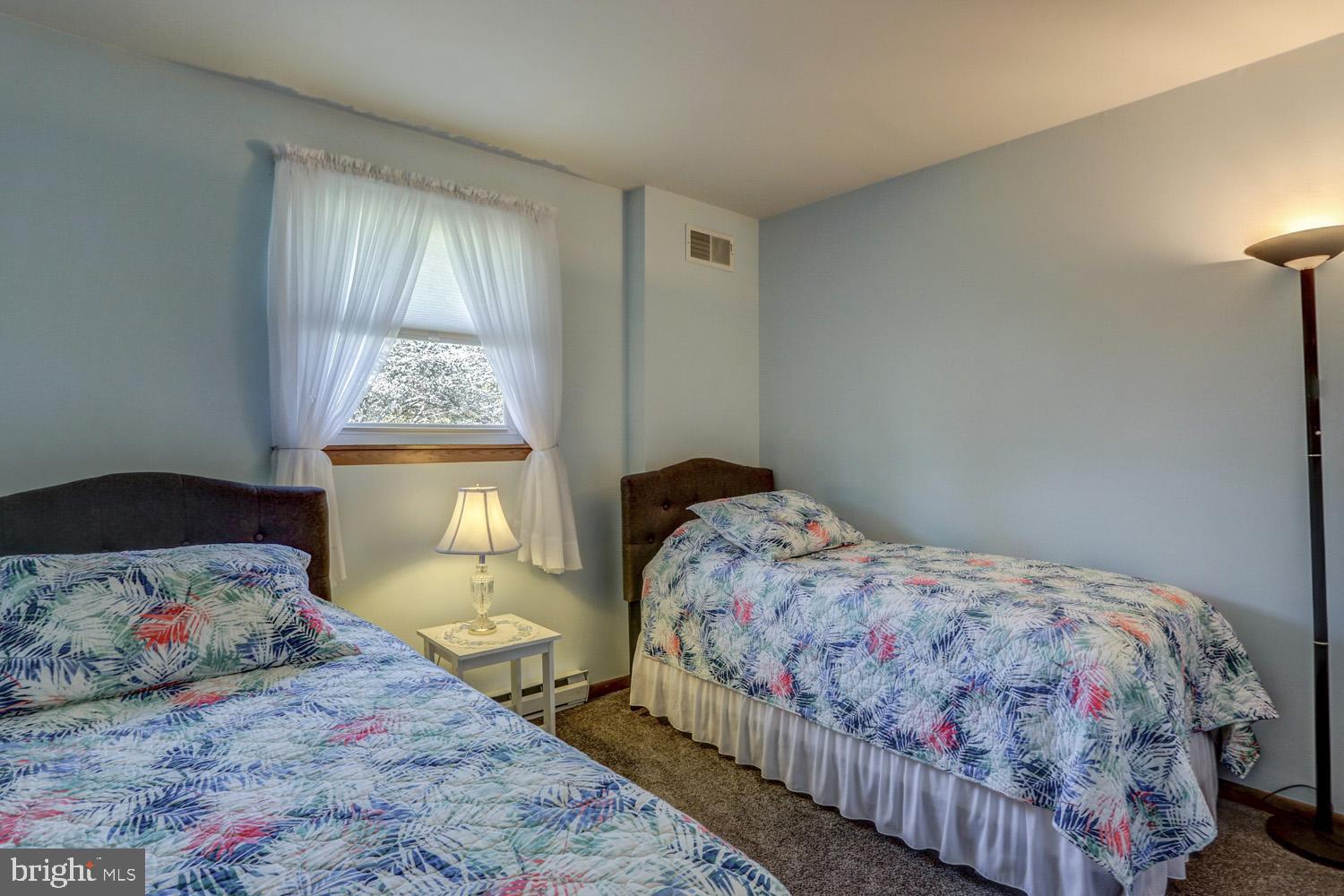31 Trail Road South Elizabethtown, PA 17022 - Photo 23 of 40 a bedroom with a bed and a lamp on dresser