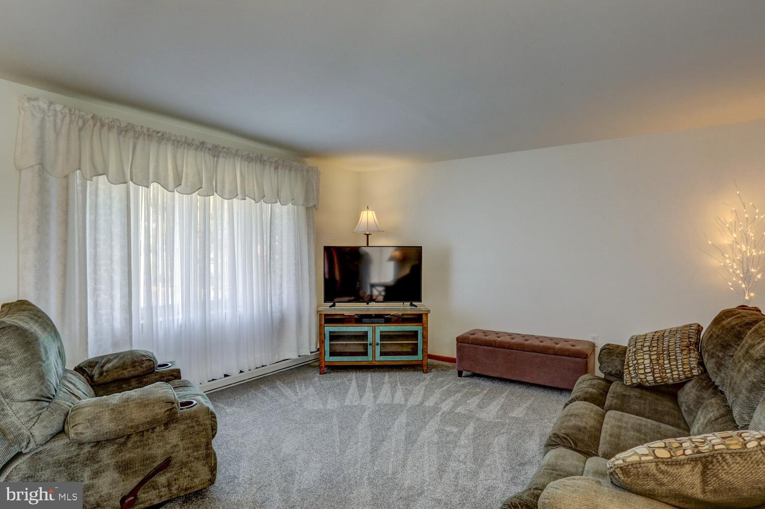 31 Trail Road South Elizabethtown, PA 17022 - Photo 7 of 40 a living room with furniture and a flat screen tv