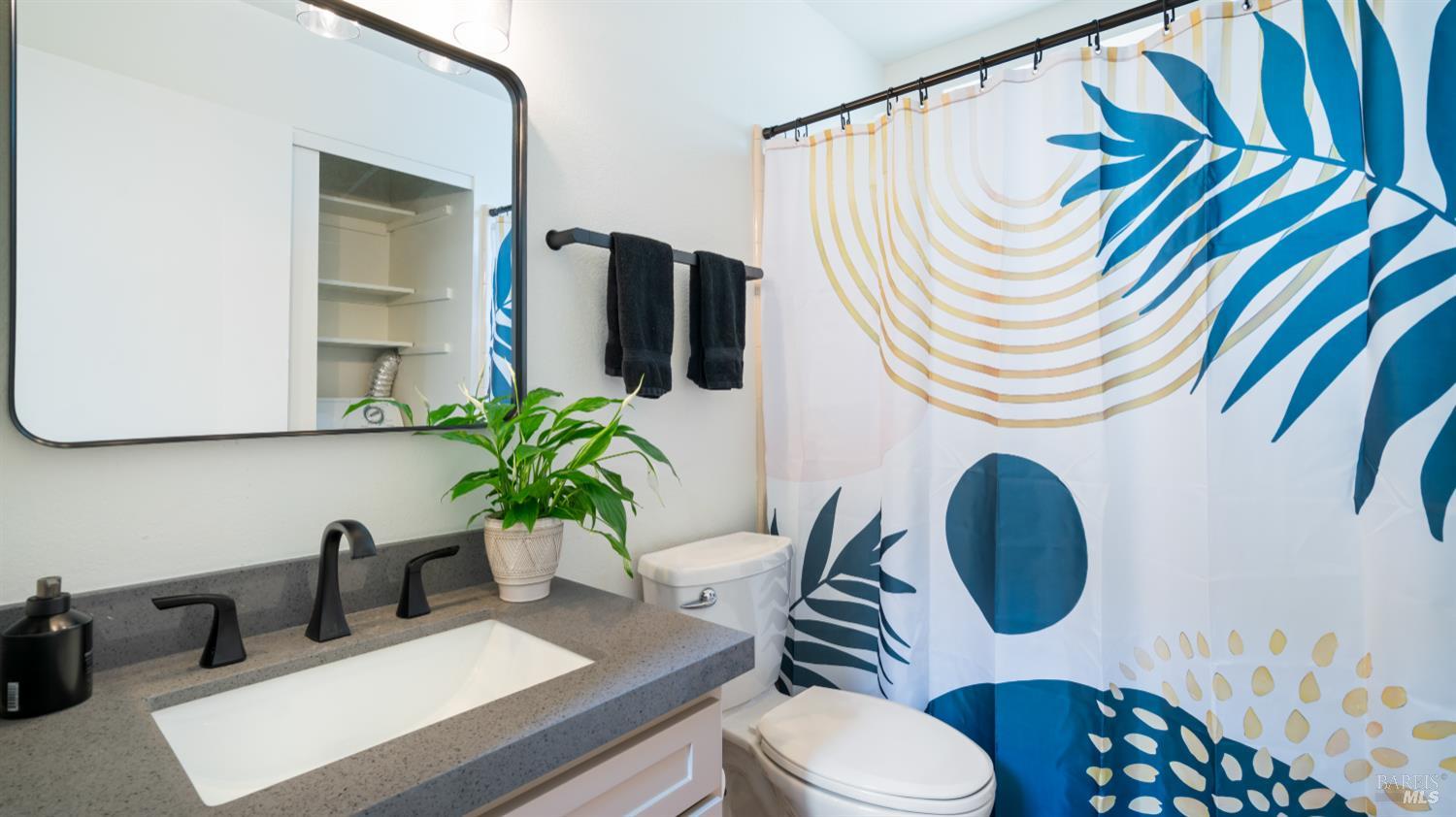 3335 Yulupa Avenue Santa Rosa, CA 95405 - Photo 13 of 33 The downstairs full bathroom has been tastefully remodeled with custom cabinetry and fresh paint, offering both style and functionality