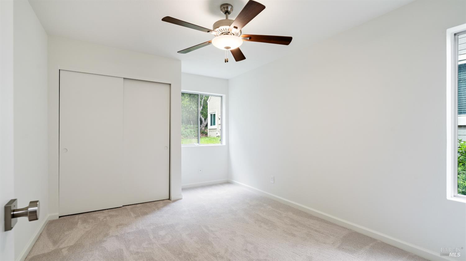 3335 Yulupa Avenue Santa Rosa, CA 95405 - Photo 20 of 39 an empty room with closet and a ceiling fan