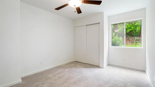 a view of front door with hallway and stairs