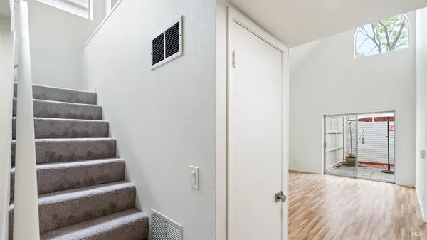 a bedroom with a bed and a rug