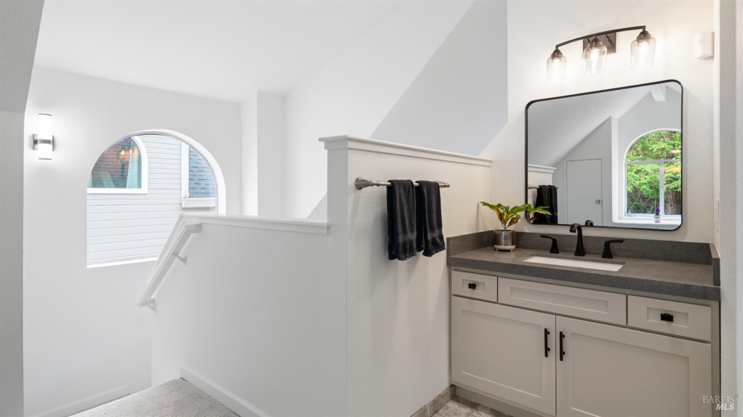 3335 Yulupa Avenue Santa Rosa, CA 95405 - Photo 23 of 33 Bright and modern, the primary bathroom includes a newly installed custom cabinet and sink vanity, combining style and functionality.