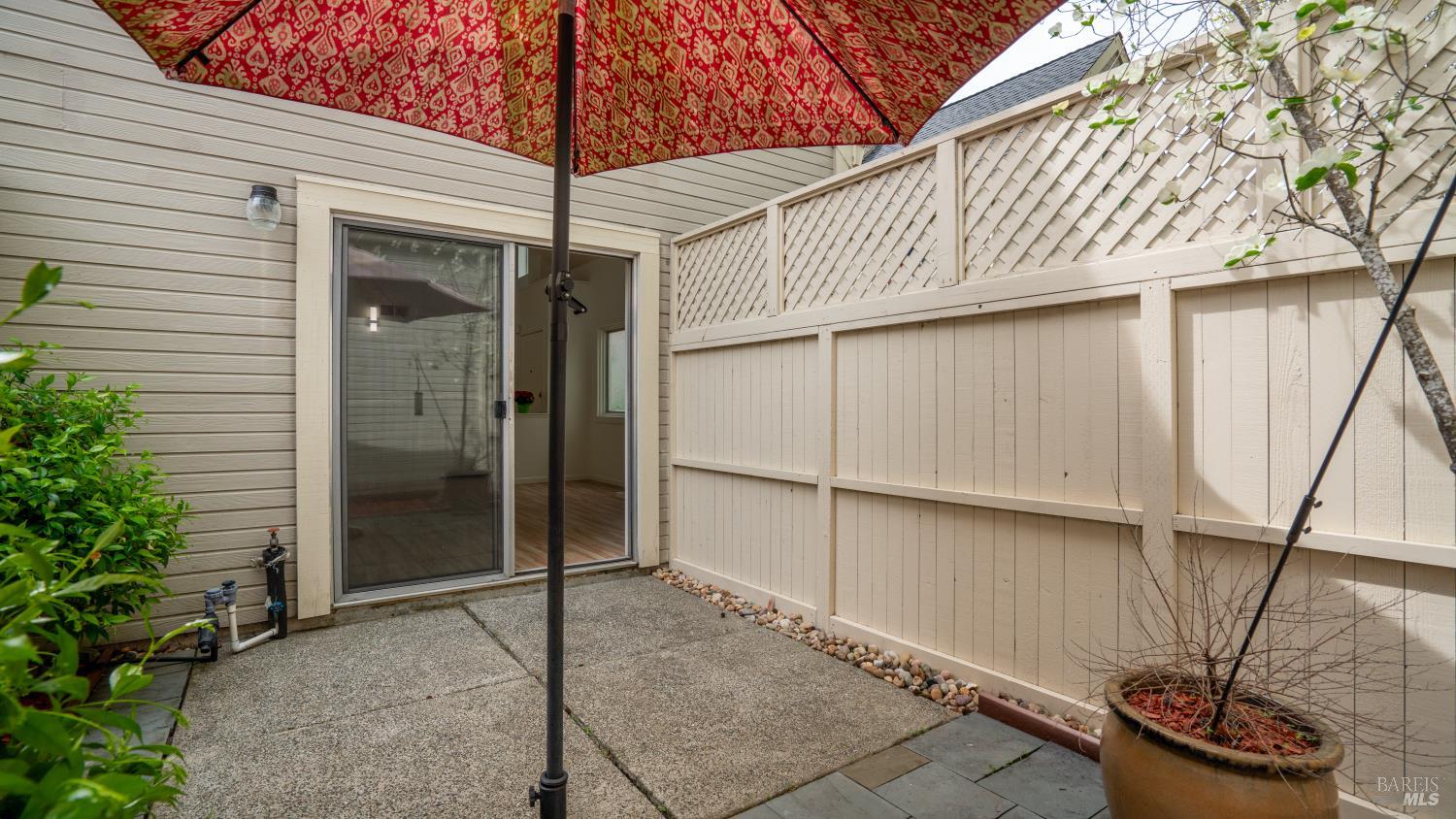 3335 Yulupa Avenue Santa Rosa, CA 95405 - Photo 7 of 33 Step outside from the living room to a great patio space, ideal for morning coffee, outdoor dining, or unwinding at the end of the day