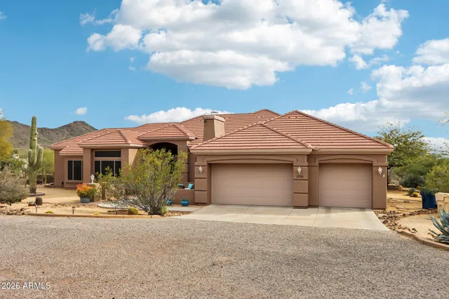 a view of a house with a outdoor space and parking space