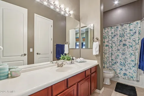 a bathroom with a bathtub and next to a window