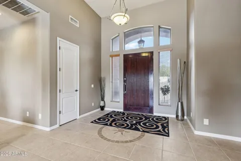 a kitchen with stainless steel appliances granite countertop a stove a sink dishwasher and a refrigerator