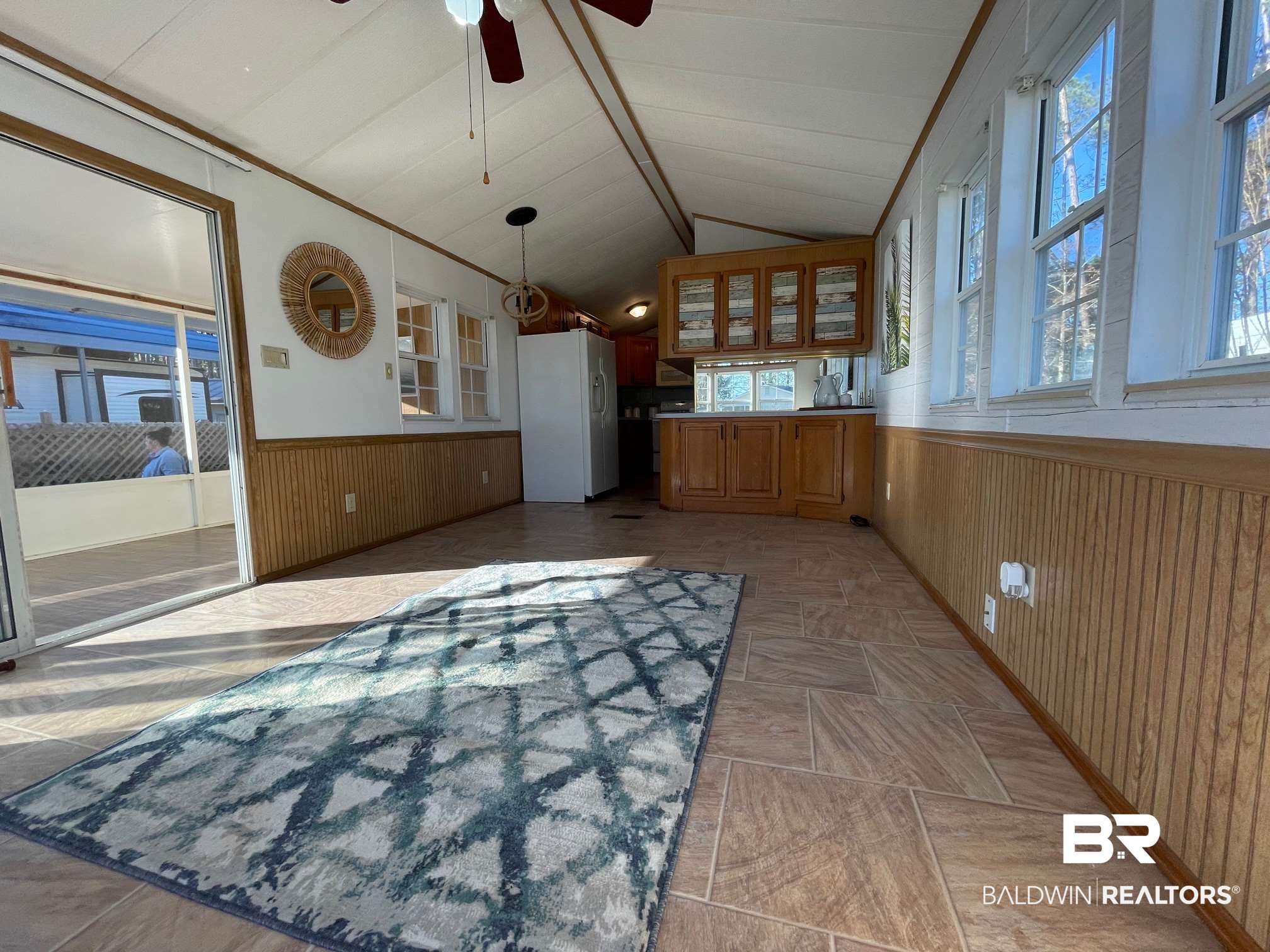 186 Defuniak Loop Lillian, AL 36549 - Photo 5 of 20 Sliding doors out to screened porch.