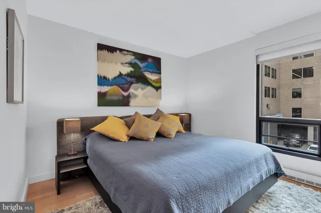 a bedroom with a bed and dresser