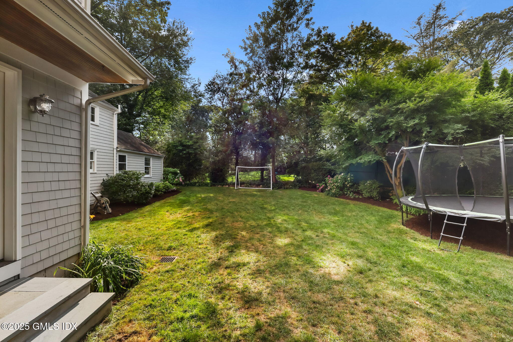 119 Hendrie Avenue Riverside, CT 06878 - Photo 6 of 7 a view of a backyard with a slide