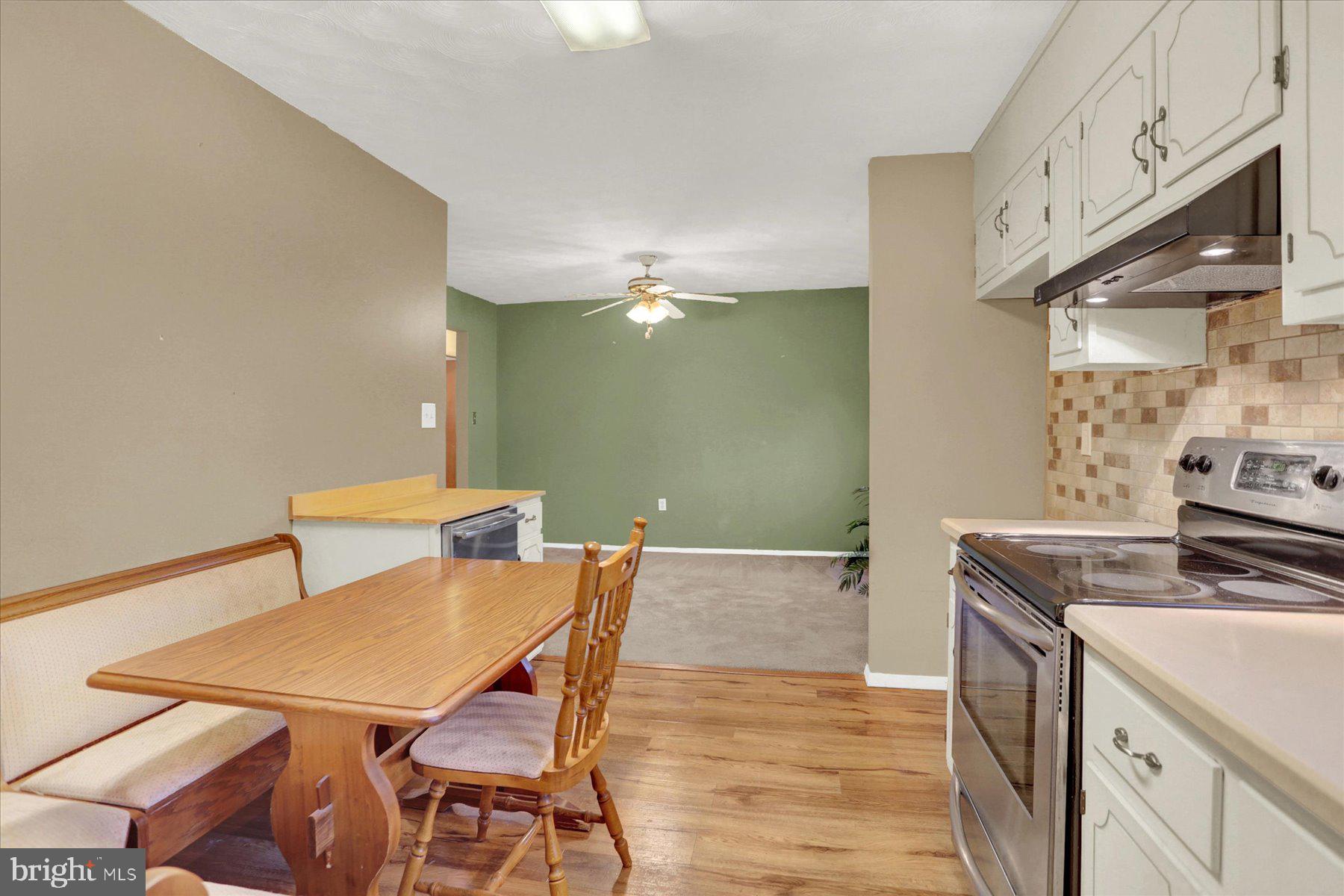 970 Cranes Gap Road Carlisle, PA 17013 - Photo 16 of 48 a kitchen with a table chairs and a stove