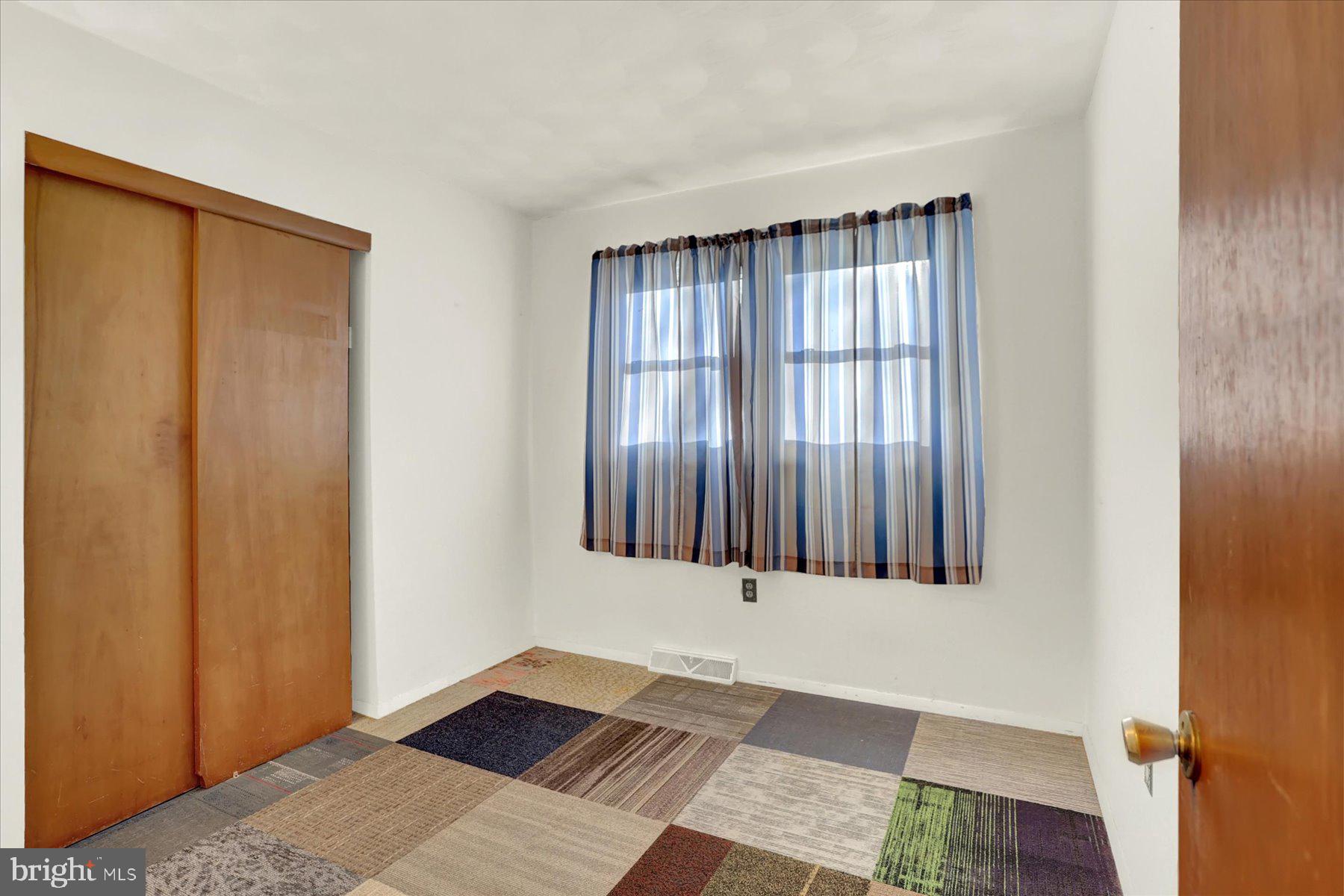 970 Cranes Gap Road Carlisle, PA 17013 - Photo 17 of 48 a view of an empty room with wooden floor and a window