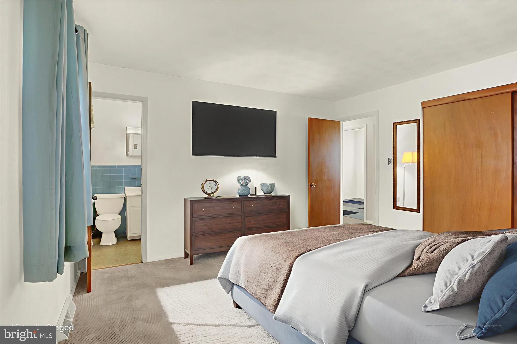 970 Cranes Gap Road Carlisle, PA 17013 - Photo 27 of 48 a bedroom with a bed and a flat screen tv