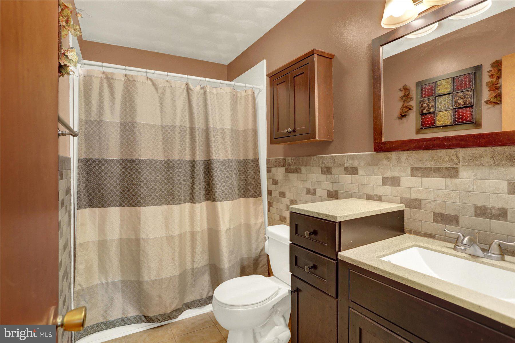 970 Cranes Gap Road Carlisle, PA 17013 - Photo 29 of 48 a bathroom with a granite countertop sink and a mirror