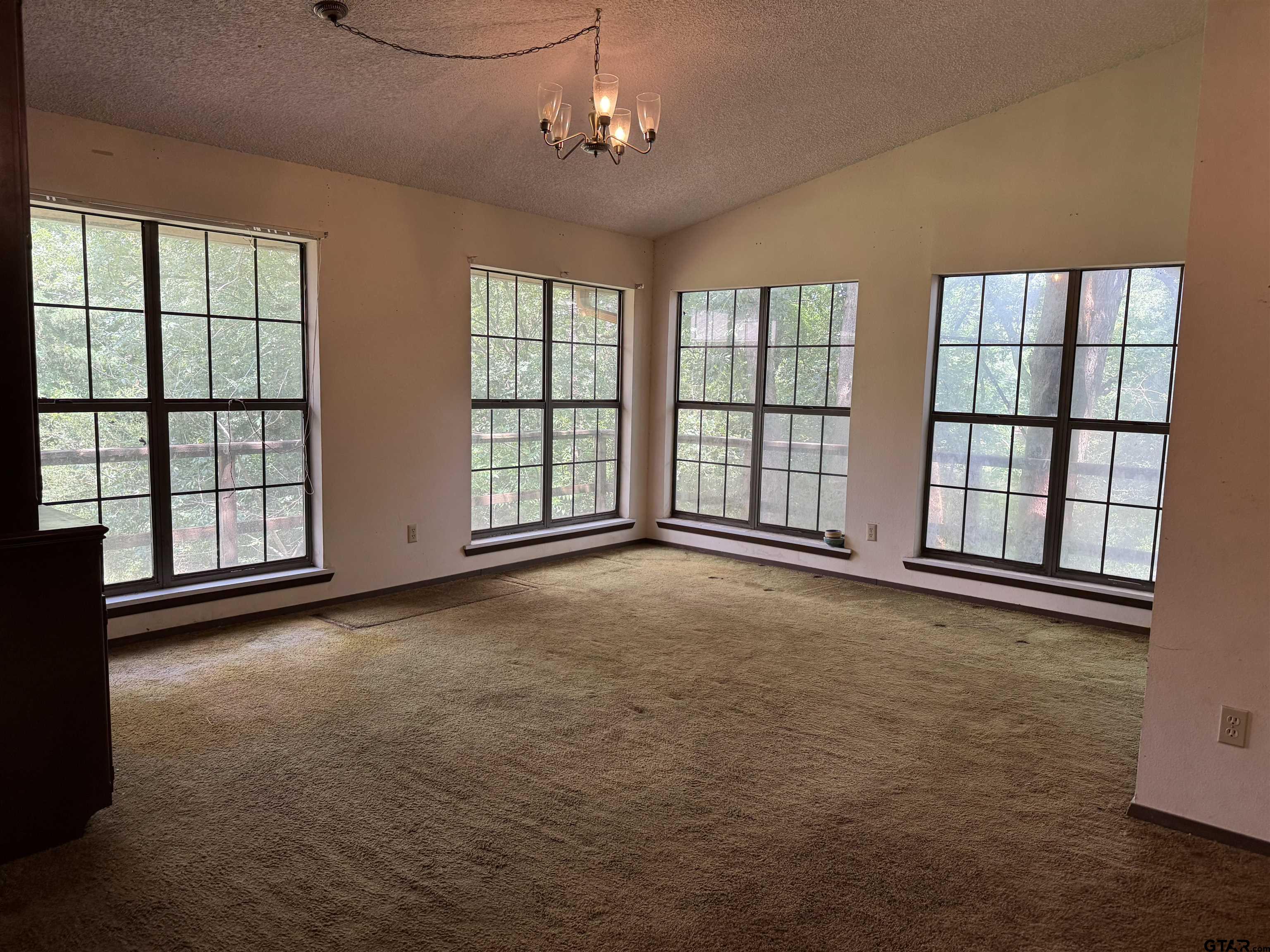 289 Llano Bend Holly Lake Ranch, TX 75765 - Photo 5 of 48 a view of an empty room with a window